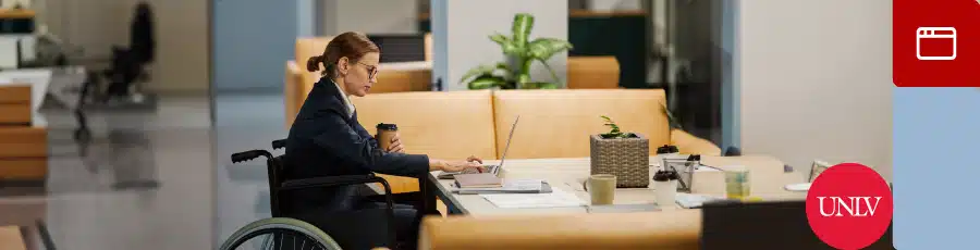 Sits next to a table and working on her computer trying to Explore Las Vegas' Thriving Tech Scene