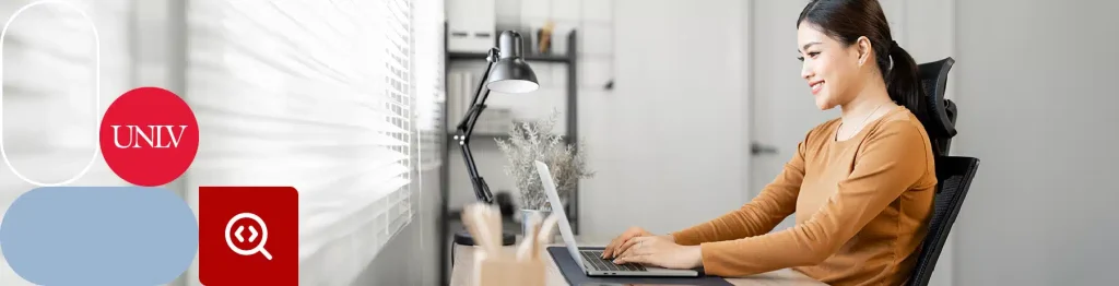 Person with headphones using laptop near window, UNLV and Pinterest logos visible